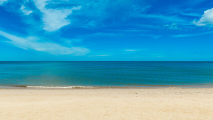 Nature of the beach and sea Summer with sunshine, sandy beaches, clear blue waters sparkling against the blue sky. On an island with good ecology and environment Background for summer vacation concept