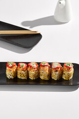 Elegant, Minimalist Tuna Tartare Pistachio Strawberry Sushi Rolls on Black Platter