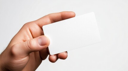Fototapeta premium Hand holding blank white business card is positioned Male making