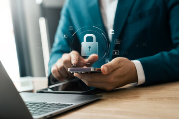 Cyber ​​security technology, data protection, businessman using mobile phone and laptop with padlock, data encryption security system, protection from hackers and viruses, data protection from crime.