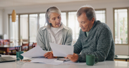 Senior couple, documents and budget planning with finance for pension, investment or expenses at home. Elderly, man and woman with paperwork for bills, funding or payments together on table at house