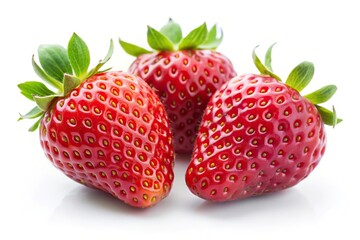 Extreme close-up of three fresh strawberries isolated on white