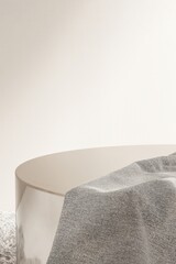 Round gold chrome podium table on shag rug with gray throw blanket in sunlight on white wall for luxury, elegant cosmetic, skincare, body care, beauty product display background 3D