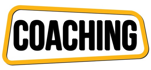 COACHING text on yellow-black trapeze stamp sign.