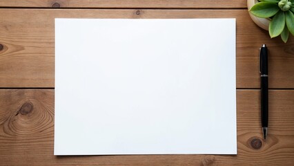 Blank white paper with a pen on a wooden desk, perfect for office, writing, or stationary-themed projects.