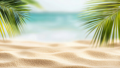 Tropical beach sand with palm trees with blurred ocean background