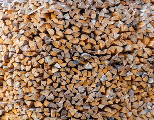 A pile of wood with many pieces of wood stacked on top of each other