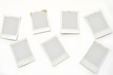 Collection of vintage Polaroid photo frames: Empty weathered templates on white background for creative projects and digital scrapbooking