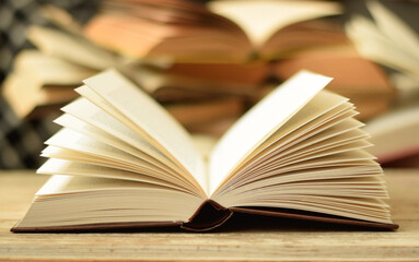Open brown hardcover thick old book. Concept to libraries and reading.
