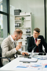 Happy businesspeople while collaborating on a new project in an office