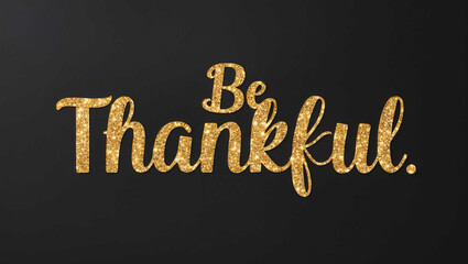 be thankful word lettering with glitter gold shining effect on plain black background