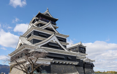 Naklejka premium The Famous Landscape vintage building of Kumamoto Castle in Northern Kyushu, Japan.