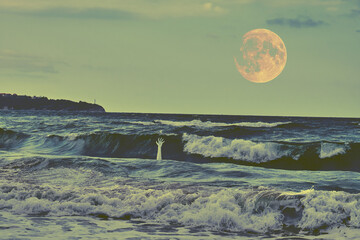 A surreal scene of ghostly hand emerging from the ocean waves beneath a large, glowing moon.