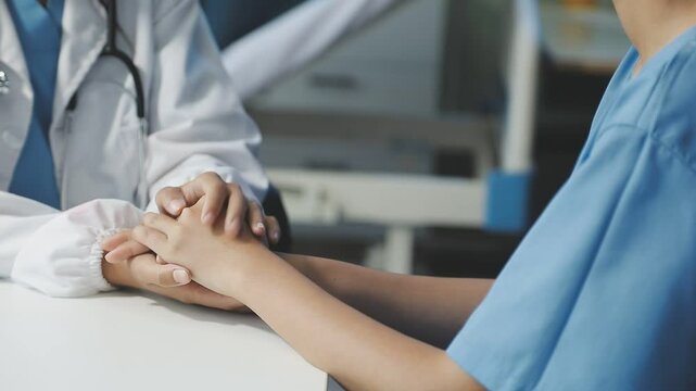 Women Asian doctors hold the patient hand and encourage and provide medical advice While checking the patient health in bed. Concept of Care and compassion, antenatal care, Threatened abortion