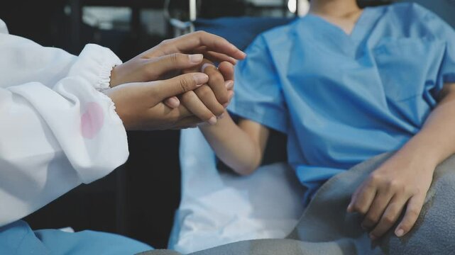 Women Asian doctors hold the patient hand and encourage and provide medical advice While checking the patient health in bed. Concept of Care and compassion, antenatal care, Threatened abortion