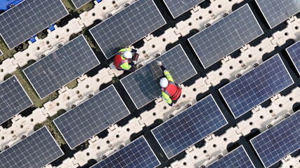 Floating solar panels providing renewable energy. Aerial view floating on solar cells