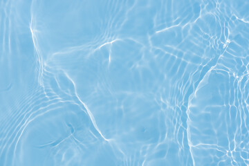 Blue water with ripples on the surface. Defocus blurred transparent blue colored clear calm water...