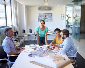 Business, people and meeting in boardroom with planning or strategy for building or infrastructure design. Employees, architects and coworking at office with brainstorming, teamwork and collaboration