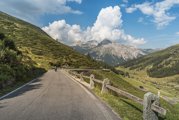 A motorcycle rides on the Spluegen pass road, Canton of Grisons, Switzerland