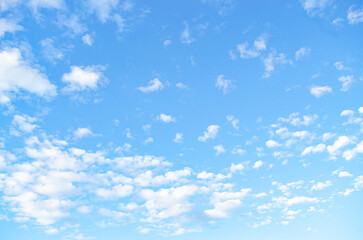 Beautiful view of blue sky with clouds at sunset. Partly cloudy.