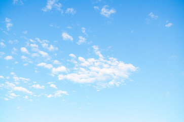 Beautiful view of blue sky with clouds at sunset. Partly cloudy.