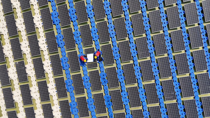 Floating solar panels providing renewable energy. Aerial view floating on solar cells