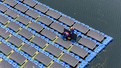 Floating solar panels providing renewable energy. Aerial view floating on solar cells