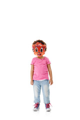 Mask, costume and child on a white background in studio for cosplay, character outfit and cartoon. Mockup space, fashion and isolated young kid with disguise for Halloween, party and hidden identity