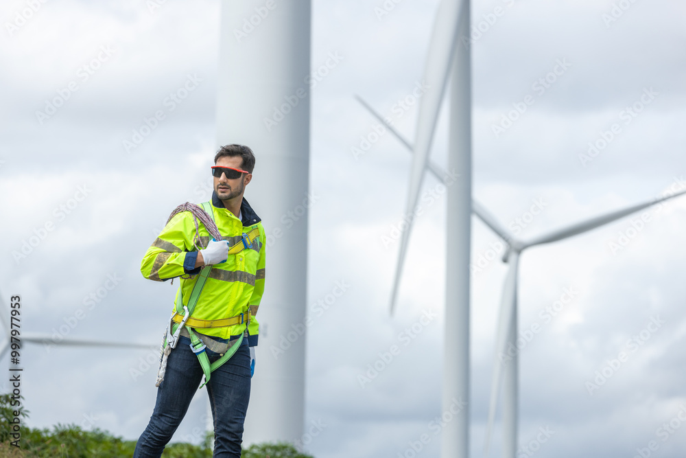 Poster Man engineers holding tools box and rope to maintenance working in wind turbine. Renewable energy power wind turbine. Technology protect environment reduce global warming problems