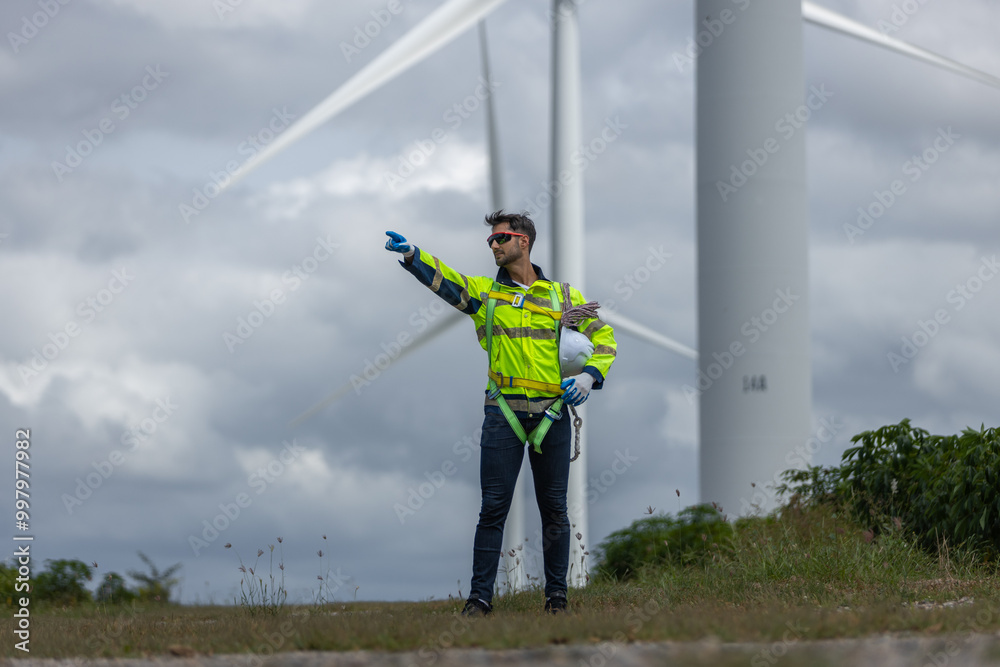 Poster Man engineers holding tools box and rope to maintenance working in wind turbine. Renewable energy power wind turbine. Technology protect environment reduce global warming problems