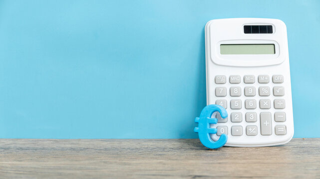 Euro Currency Symbol and Calculator on a Clean Blue Background with copy space. - Powered by Adobe