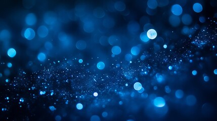 An abstract dark blue bokeh background, featuring a beautiful array of soft, out-of-focus lights that create a dreamy, atmospheric effect. 