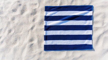 Obraz premium Beach towel mockup spread out on the sand 