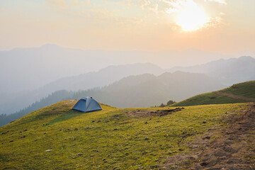 Camping tent outdoor. Camping leisure and destination travel near green forest mountain.Tourism relax and chill in  Tirthan Valley,Shangarh himachal pradesh india.
