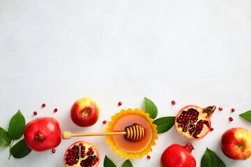 Rosh Hashana, Jewish New Year, background with pomegranate, apple and honey, traditional food for the holiday