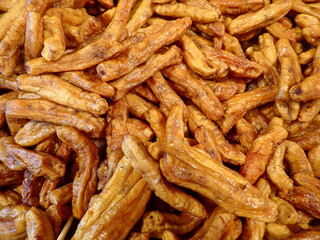 Close up of organic thai banana. Sun dried banana. Fruit snack. Musa (AA group) “Kluai Leb Mu Nang”
