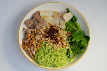 One of the foods that Thai people eat is dry jade noodles.