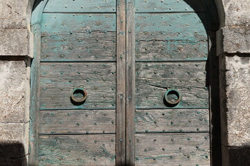 Weathered Wooden Door with Ring Door Pulls in Rural Village, Italy