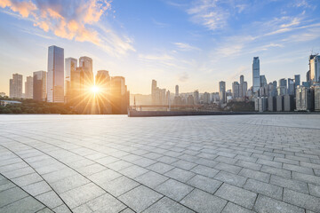 Empty square floor and city skyline with modern buildings scenery at sunrise in Chongqing. car advertising background.