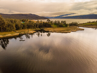 Drone aerial view over the cocha lake on sunset in nariño colombia 