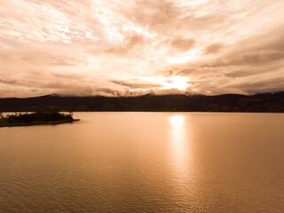 Obraz premium Amazing aerial view of la cocha lake on sunset in nariño colombia 