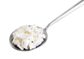 Cottage cheese in a spoon isolated on white background. With clipping path.