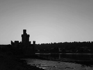 Blackrock castle observatory silhouette in the rays of sunset sun black and white monochrome background © Studio-M