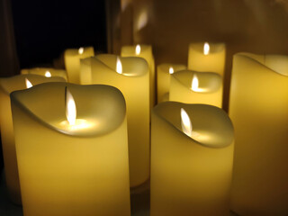 Artificial electric candles close view background, romantic atmosphere