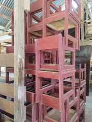 Obraz premium Stacked wooden chairs. No people.