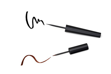 Black and Brown Eyeliners and strokes isolated on white, top view