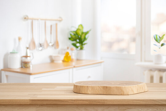 Podium or cutting board on wooden table on defocused rustic kitchen bench interior background
