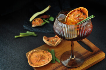 Bael Fruit Juice Top with Dried Bael and Pandan Leaf