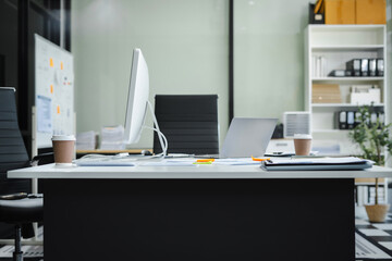 Work place concept : Mock up Blank screen computer desktop with keyboard in office or co-working background.