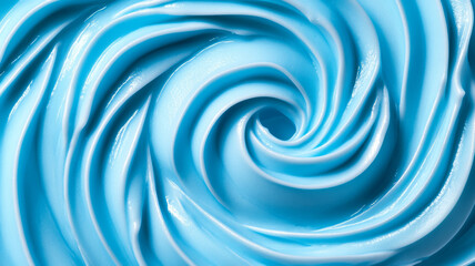 Closeup of icy blue cream swirls with a glossy light reflecting texture on a white background 